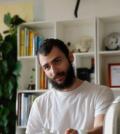 Photo of man, Thiago Brago, in a white t-shirt
